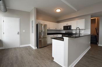 Breakfast bar with granite countertops at Marshall Place Apartments